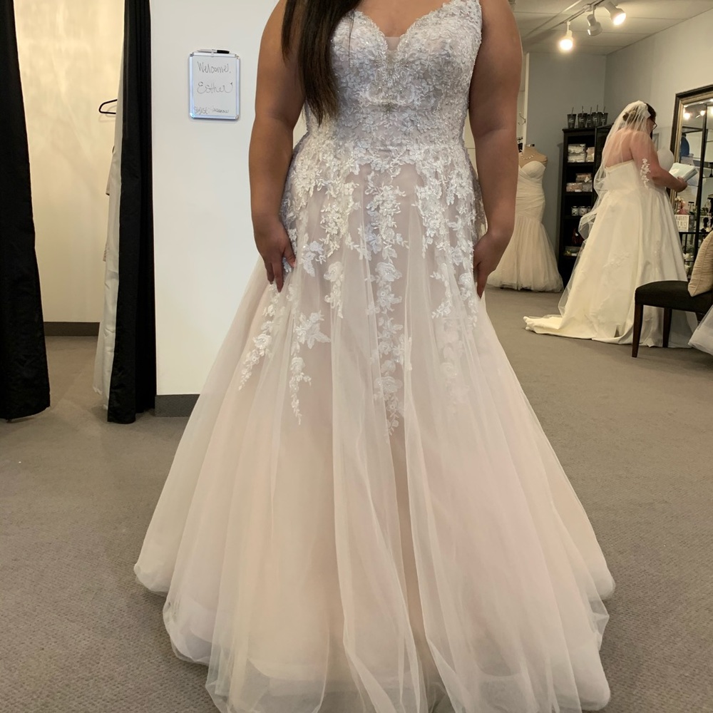Wedding dress never worn. Altered to my height of 5”5 ended up getting another